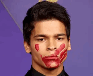 Oji-Cree actor D'Pharaoh Woon-A-Tai with a red handprint across his mouth.